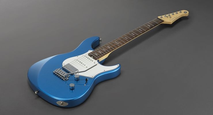 Sparkle Blue Pacifica Professional with rosewood fingerboard laying on ground.