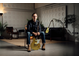 Chris Buck sentado segurando sua guitarra Signature Revstar RS02CB